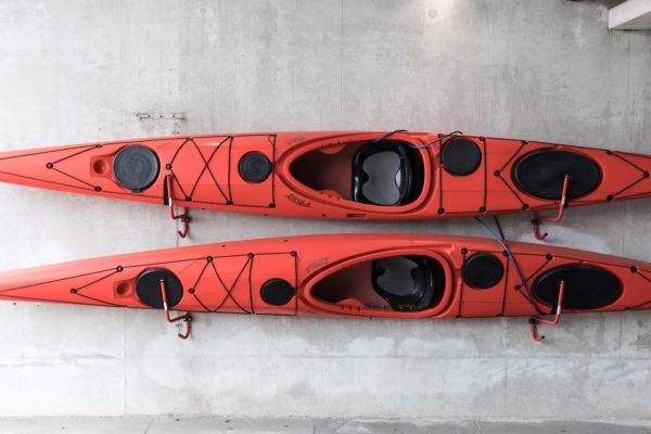 two kayaks stored on wall d14abcad